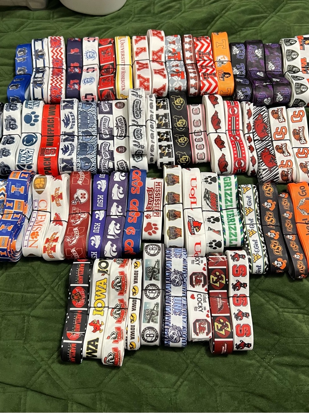 Assorted Collegiate & Sports Logo Ribbon lot. 
Different widths & several yards